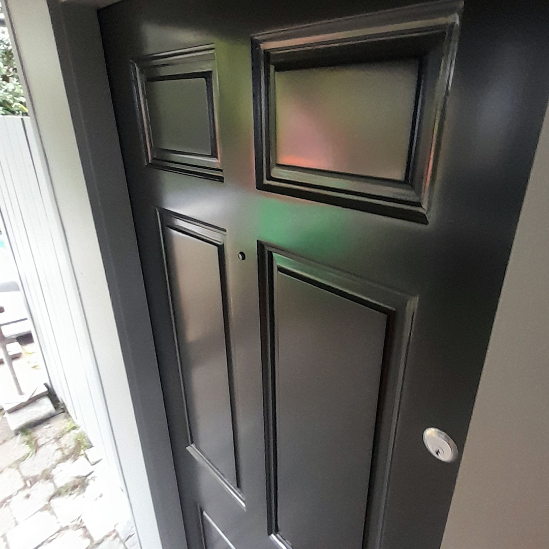 a black door with a square design